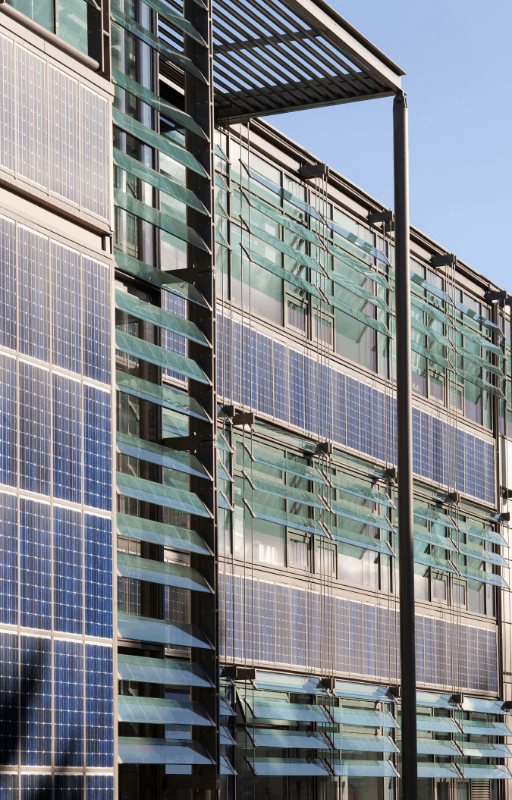 solar panels on the side of a large office building